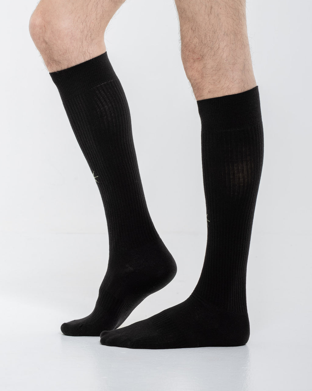 Cardo Radura Apex Knee High socks in black, side view on a model against a white background.