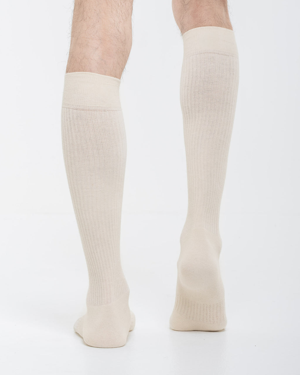Cardo Radura Apex Knee High socks in ecru, rear view on a model against a white background.