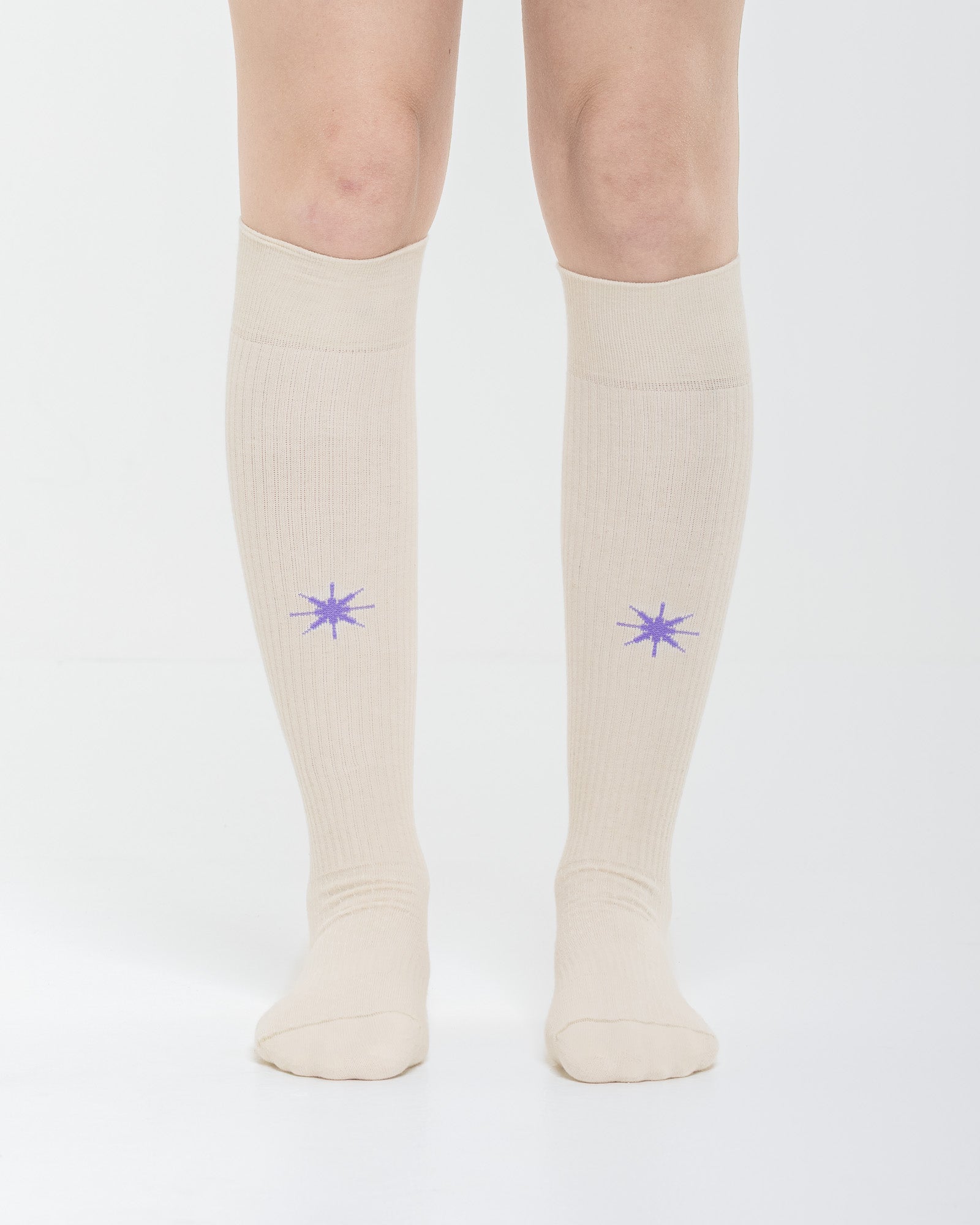Cardo Radura Apex Knee High socks in ecru, front view showing the embroidered star detail.