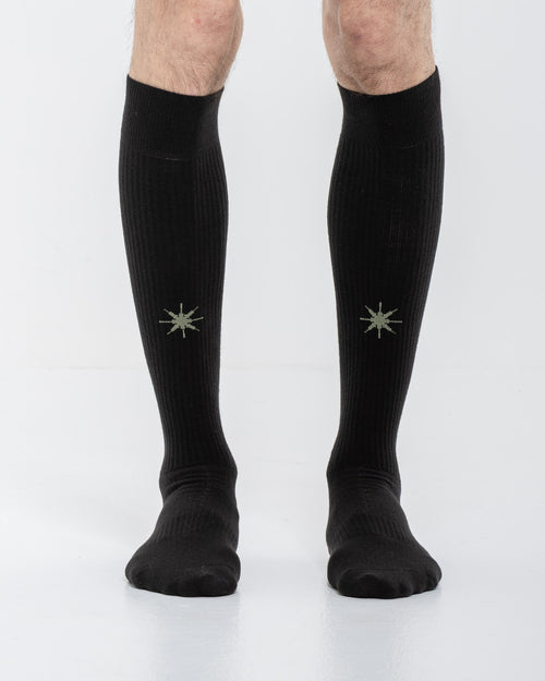 Cardo Radura Apex Knee High socks in black, front view on a model against a white background.