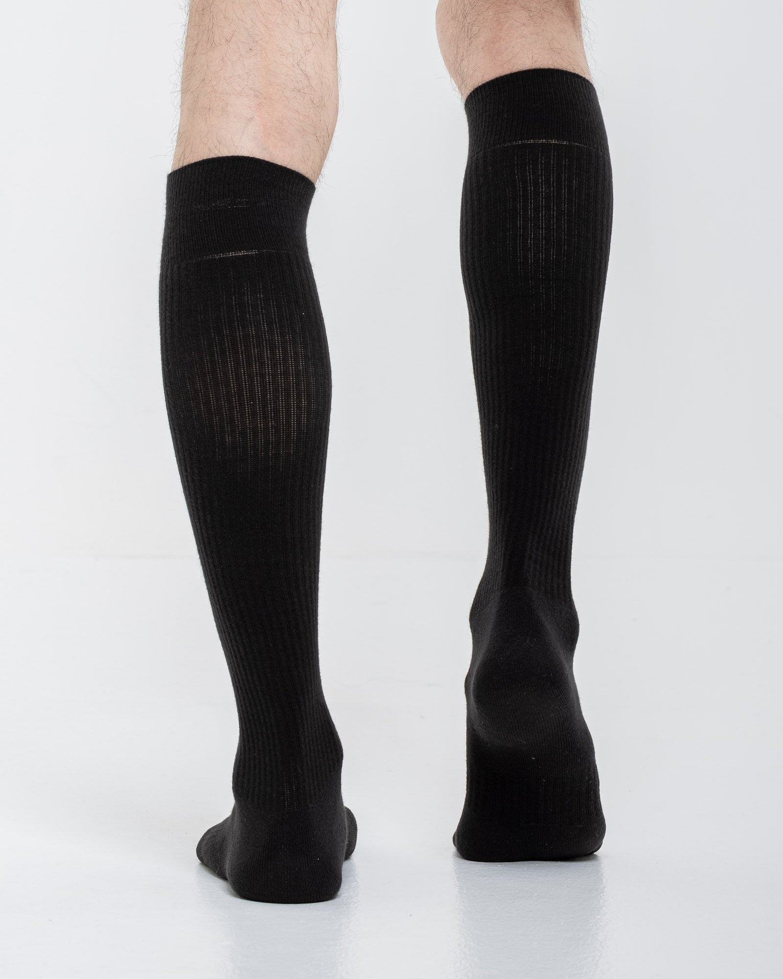 Cardo Radura Apex Knee High socks in black, rear view on a model against a white background.