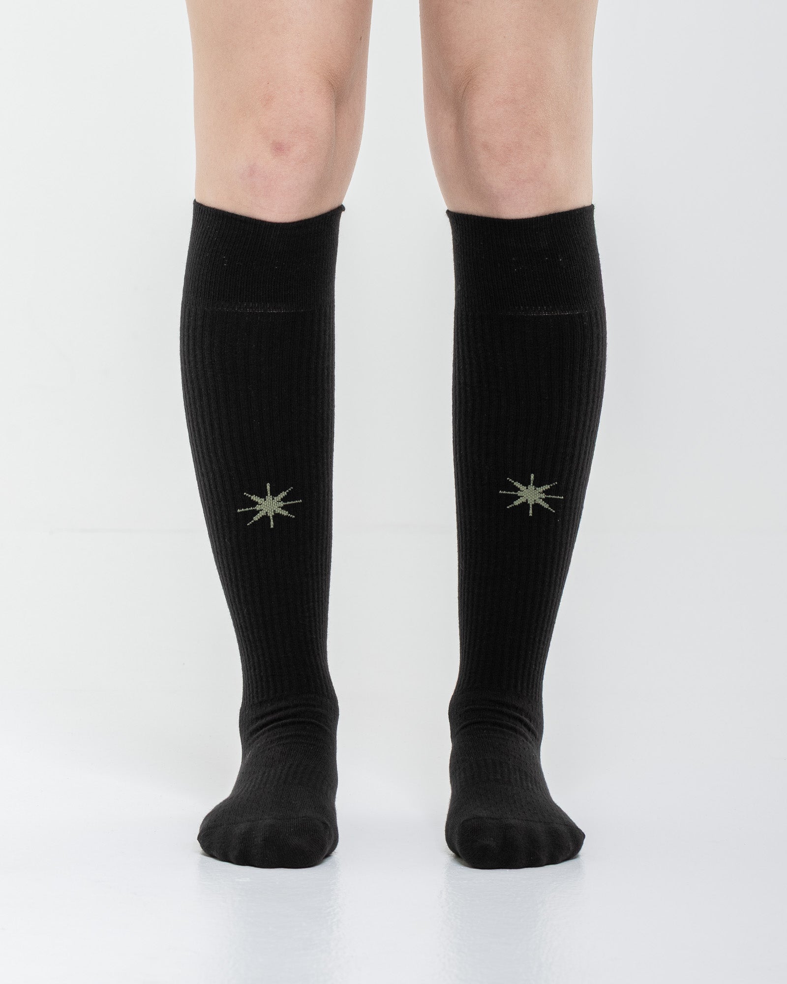 Cardo Radura Apex Knee High socks in black, front view showing the embroidered star detail.