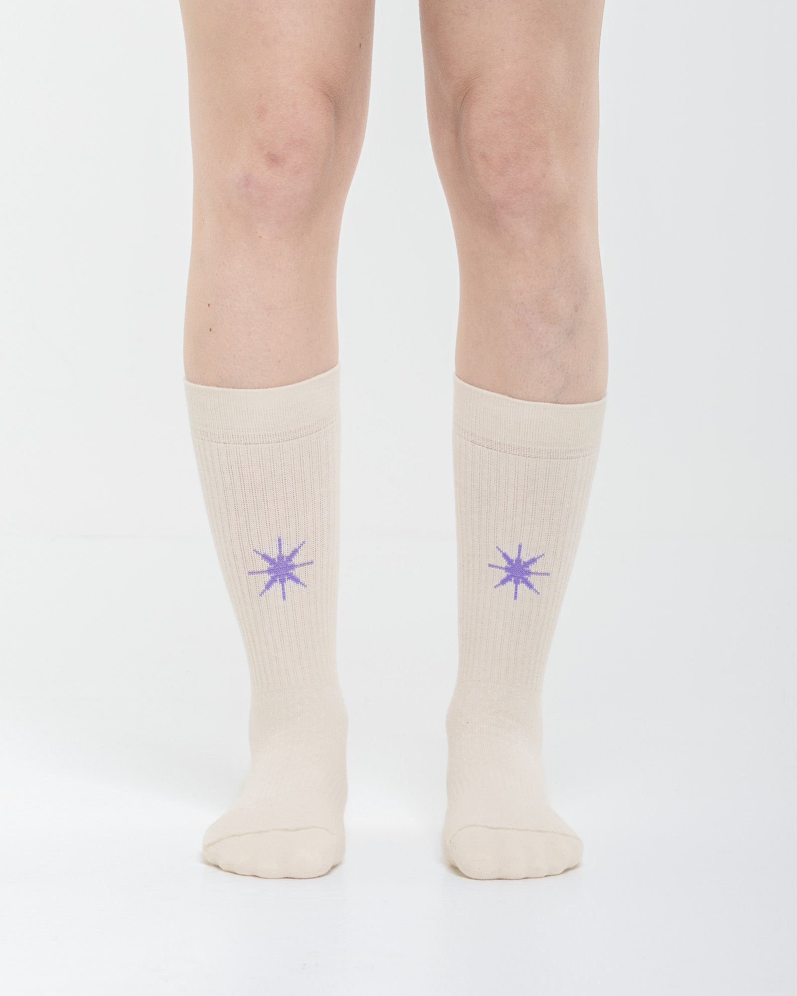 Cardo Radura Apex Half Calf socks in ecru, front view showing the embroidered star detail.