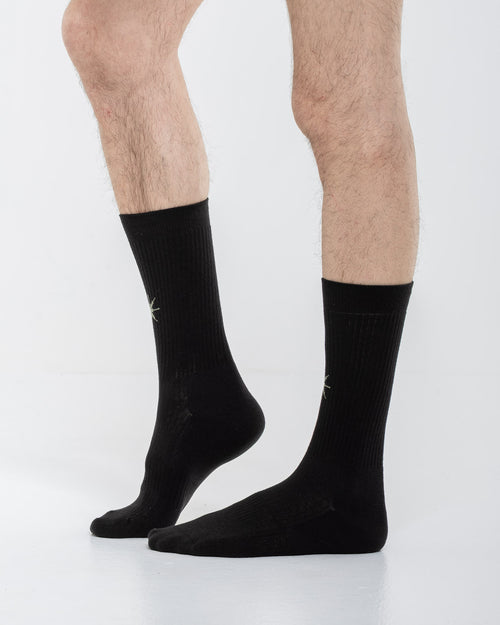 Cardo Radura Apex Half Calf socks in black, side view on a model against a white background.