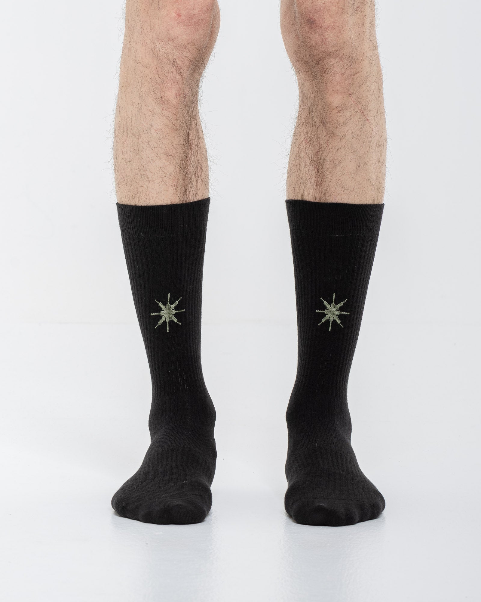 Cardo Radura Apex Half Calf socks in black, front view on a model against a white background.