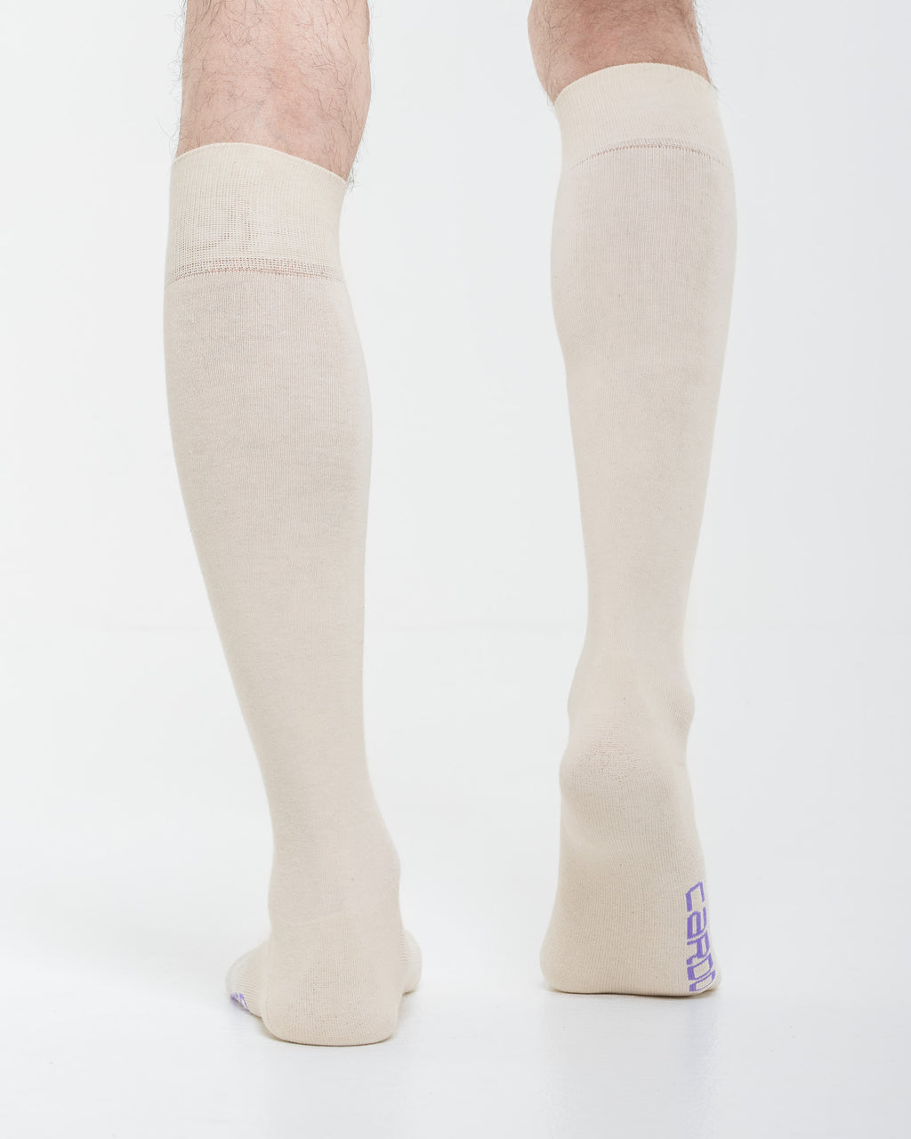 Cardo Radura Field Knee High socks in ecru, rear view showing the heel branding.