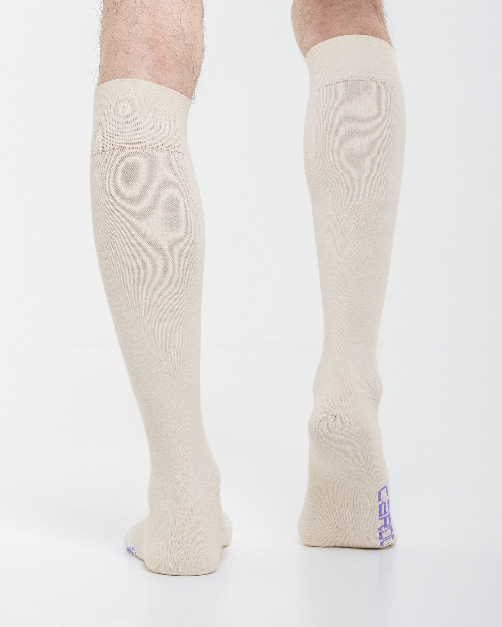 Cardo Radura Field Knee High socks in ecru, rear view showing the heel branding.