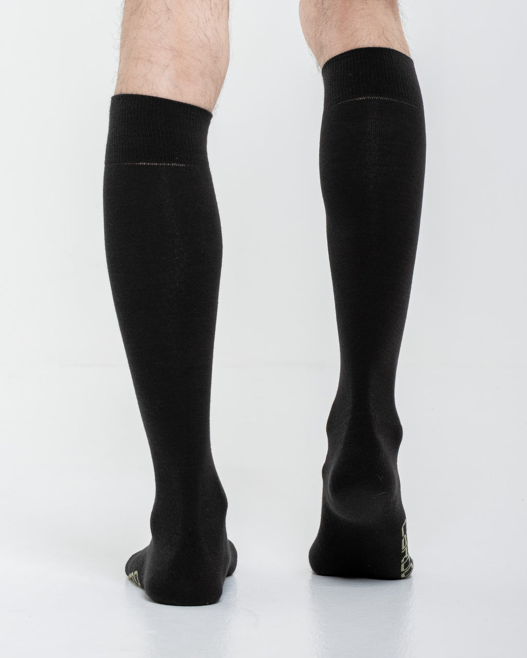 Cardo Radura Field Knee High socks in black, rear view showing the heel branding.