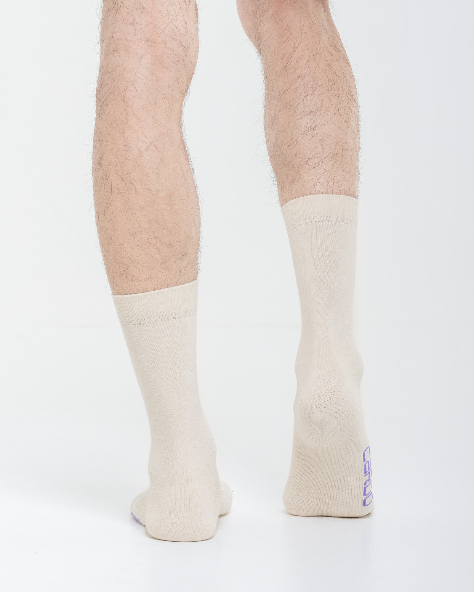 Cardo Radura Field Half Calf socks in ecru, rear view showing the heel branding.