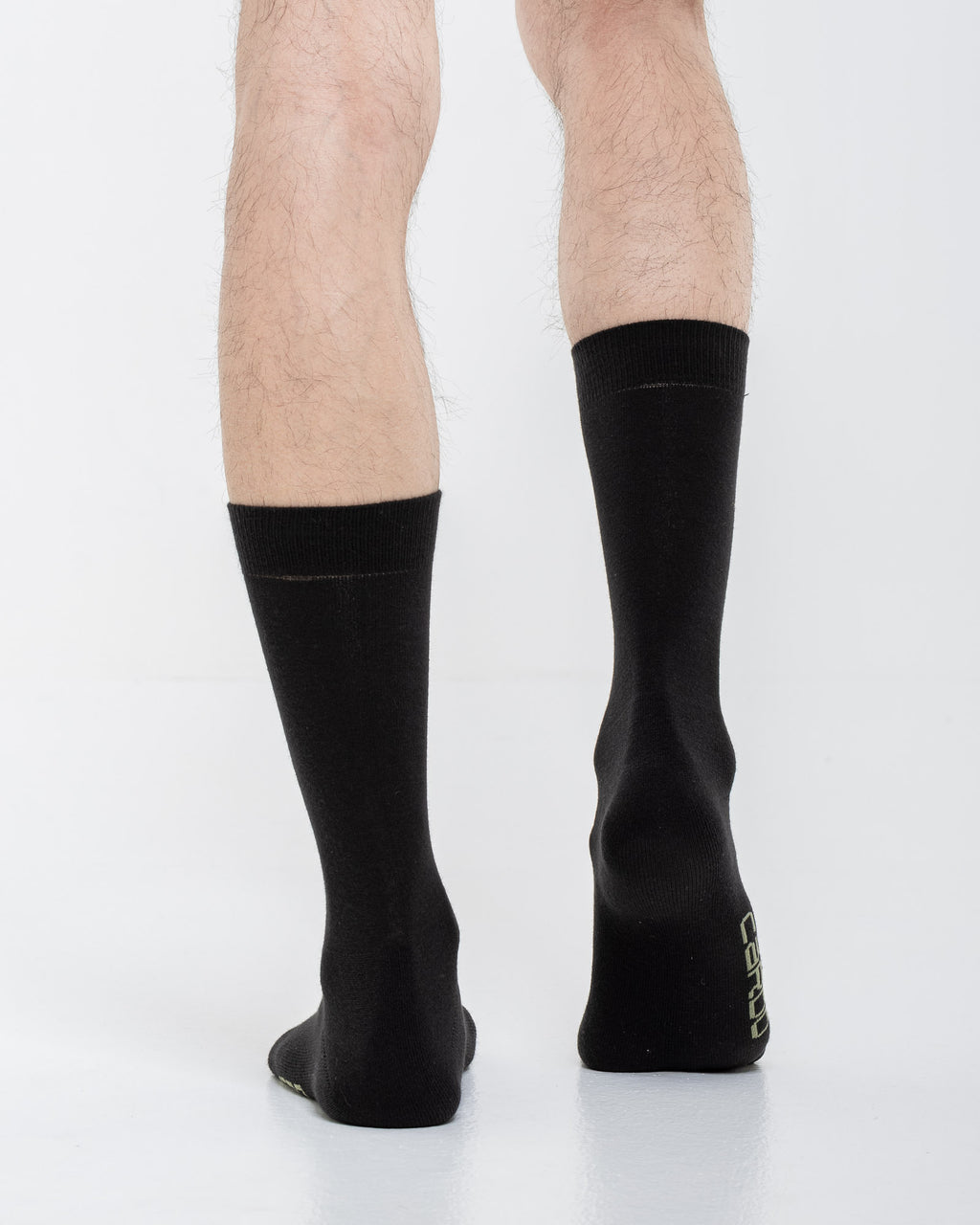 Cardo Radura Field Half Calf socks in black, rear view showing the heel branding.