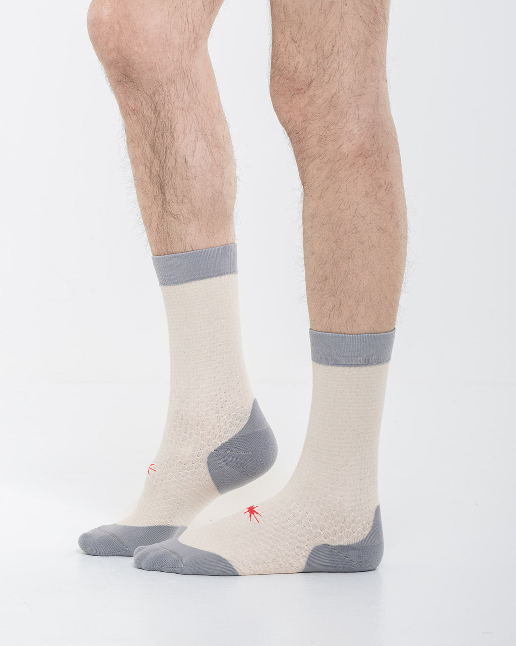 Cardo Radura Strata Lite Half Calf socks in Stone, side view showing the grey cushioned heel and toe.