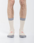 Cardo Radura Strata Lite Half Calf socks worn by a model against a white background.