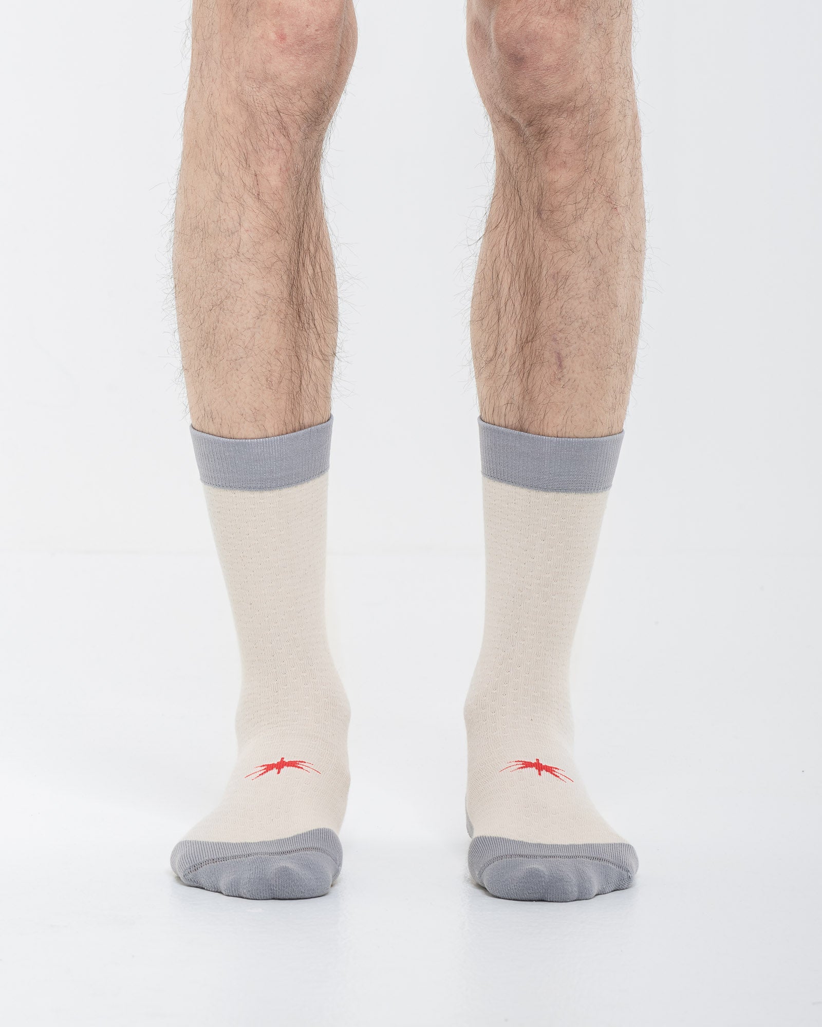 Cardo Radura Strata Lite Half Calf socks worn by a model against a white background.
