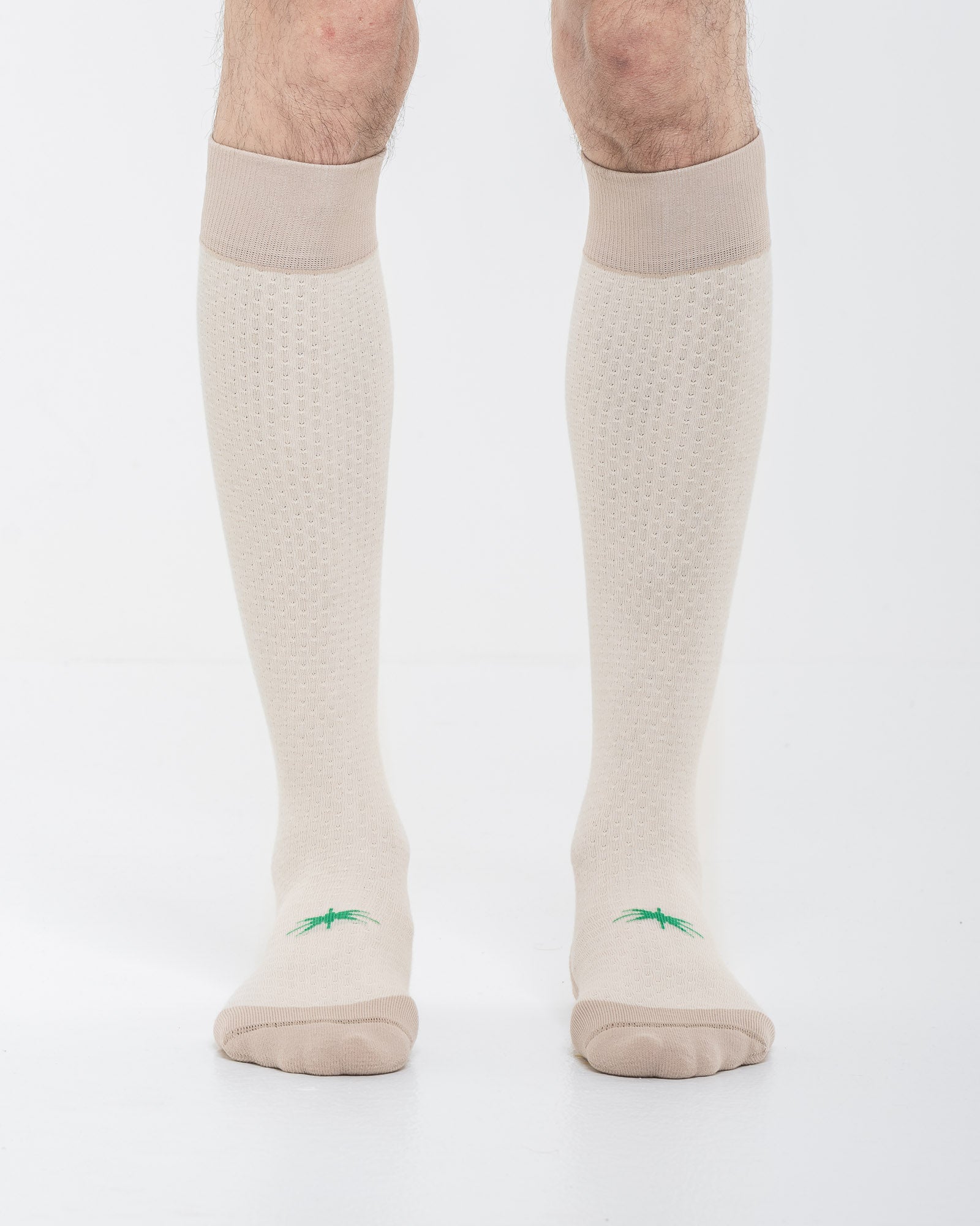 Cardo Radura Strata Lite Knee High socks in Dove, front view showing the green embroidered star detail.