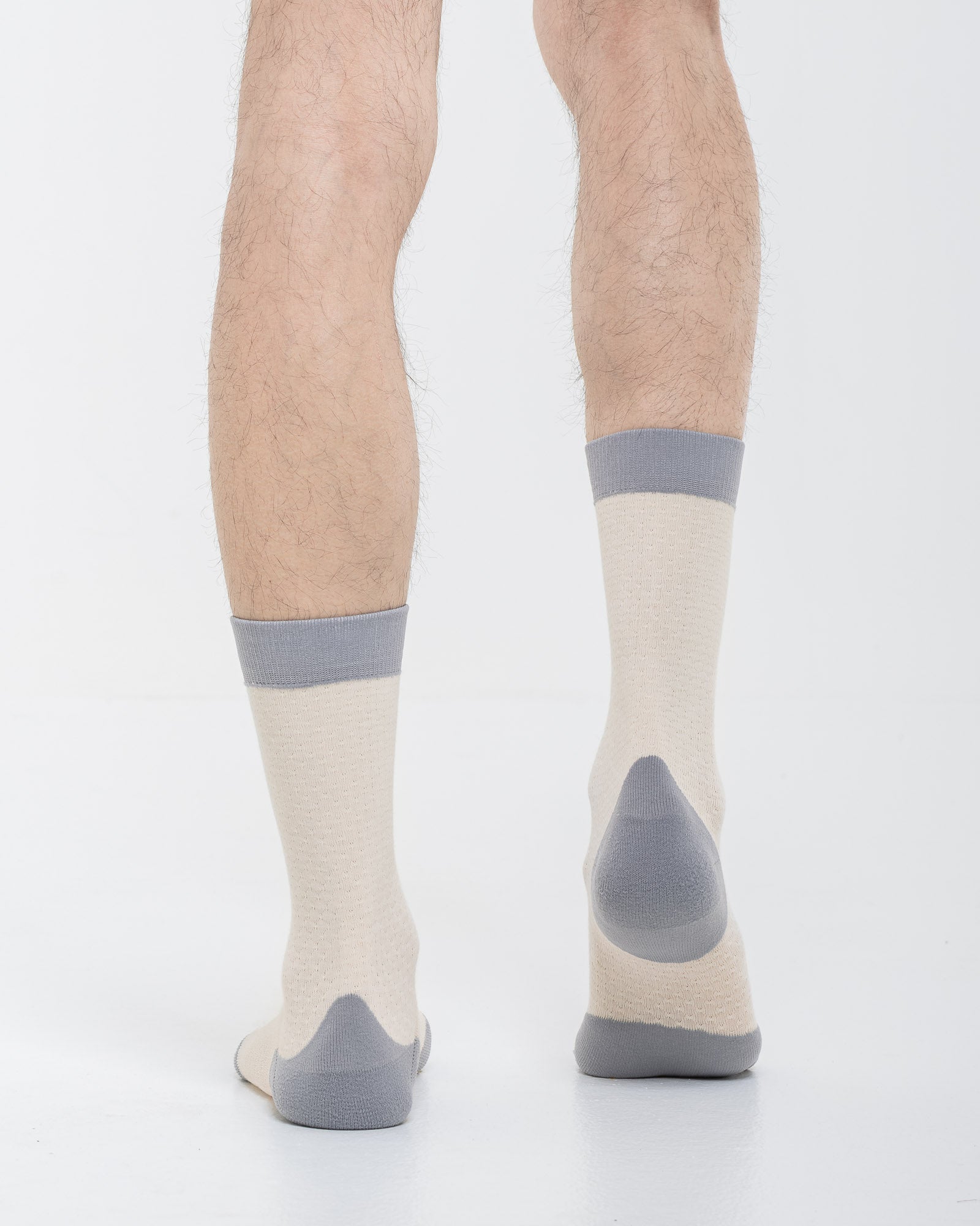 Cardo Radura Strata Lite Half Calf socks in Stone, rear view showing the grey reinforced heel.
