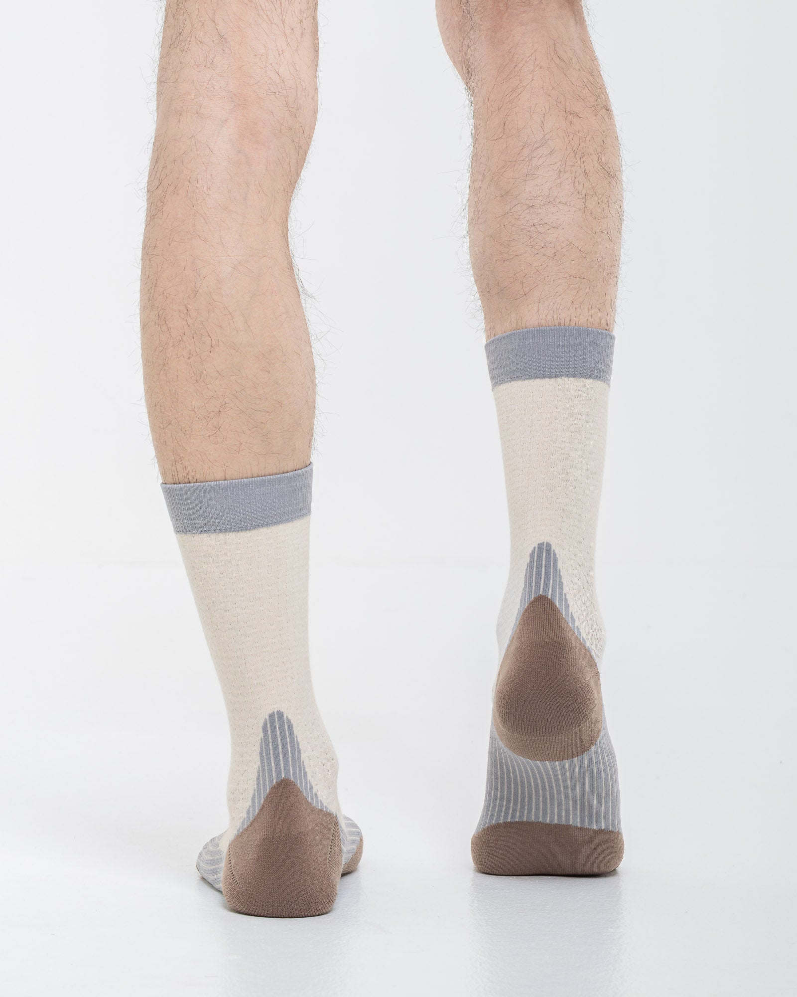 Cardo Radura Strata Half Calf socks in ecru, grey and brown, rear view showing the reinforced heel.