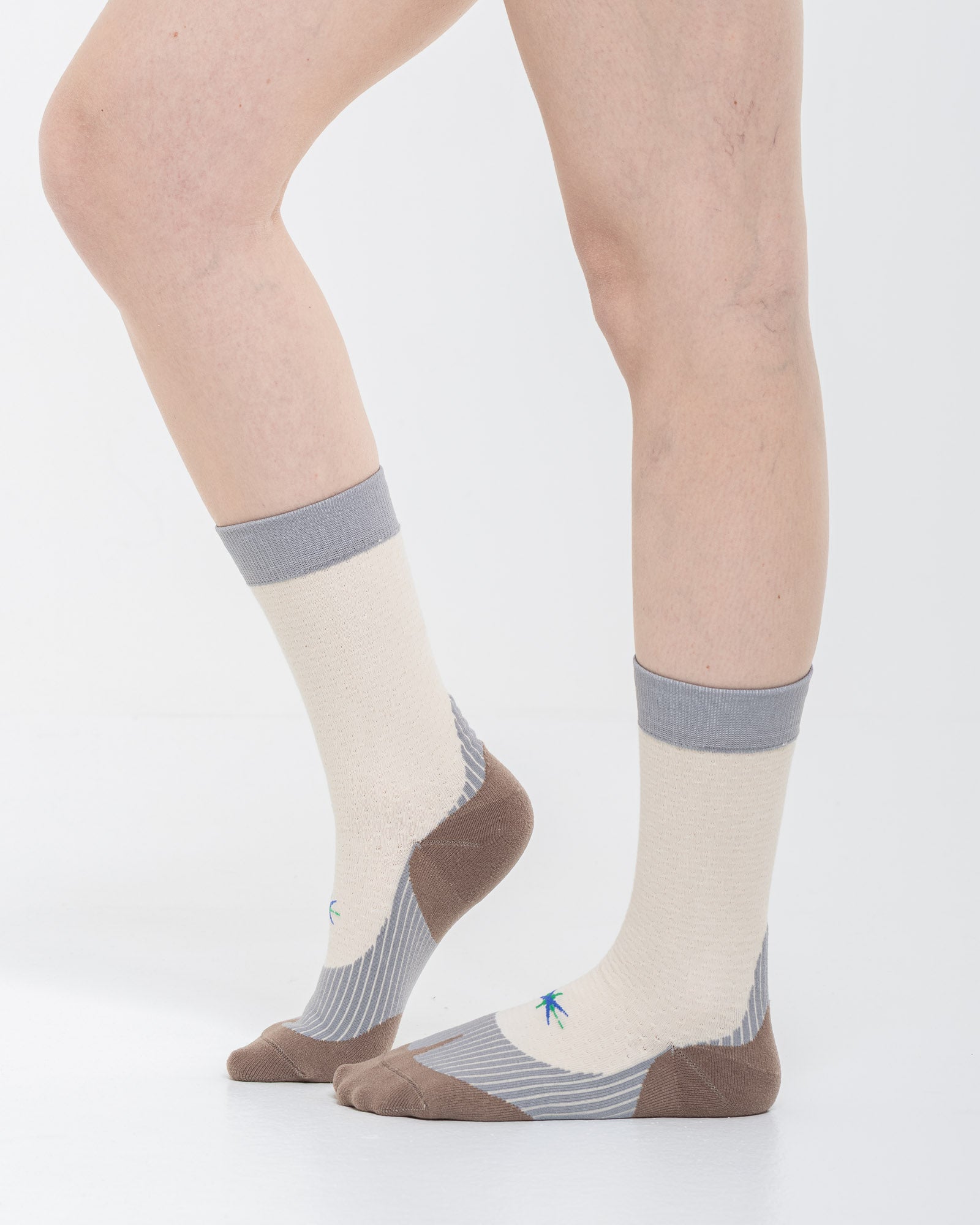 Cardo Radura Strata Half Calf socks in ecru, grey and brown, side view showing the cushioned sole and heel.