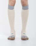 Cardo Radura Strata Knee High socks worn by a model against a white background.